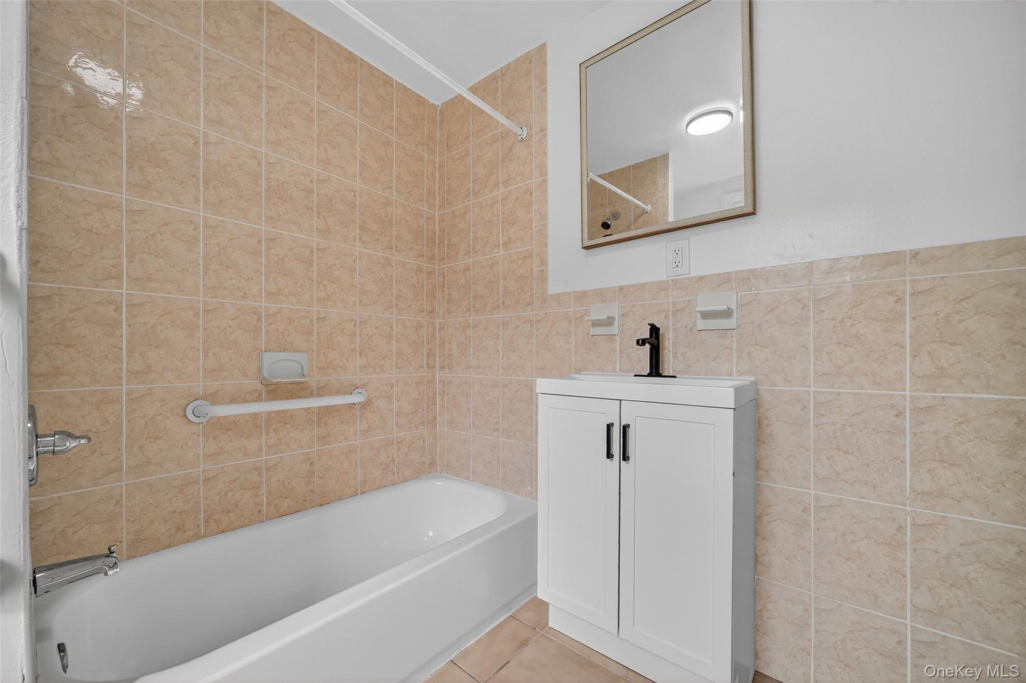 23 Ann Street, Unit 2 Ossining, NY 10562 - Photo 11 of 23 a bathroom with a sink a toilet and bathtub