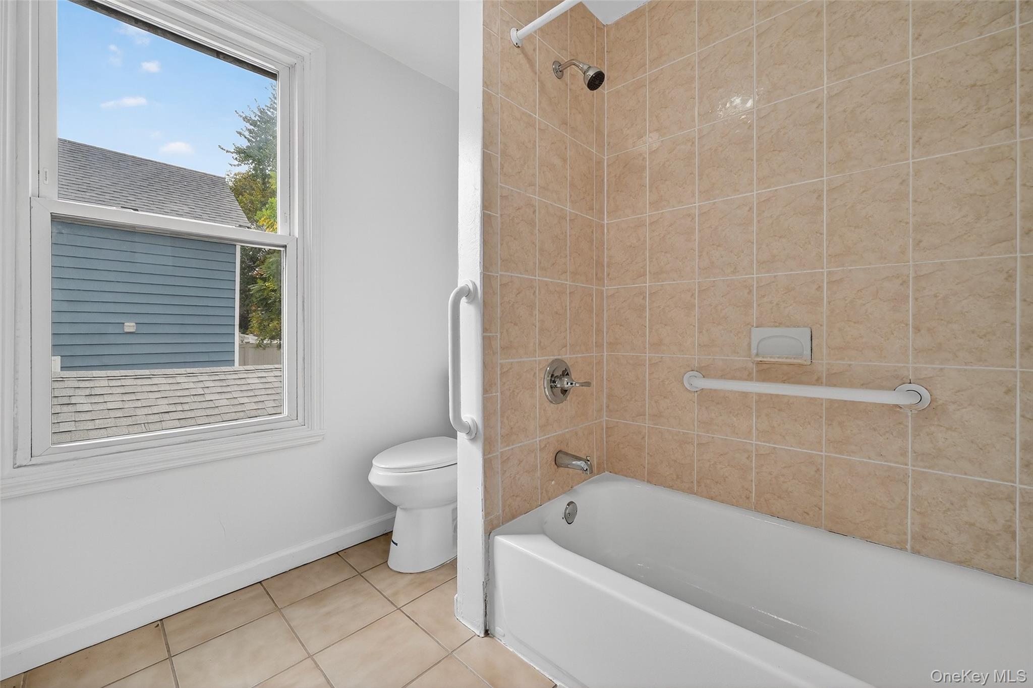 23 Ann Street, Unit 2 Ossining, NY 10562 - Photo 12 of 23 a bathroom with a toilet a sink and bathtub