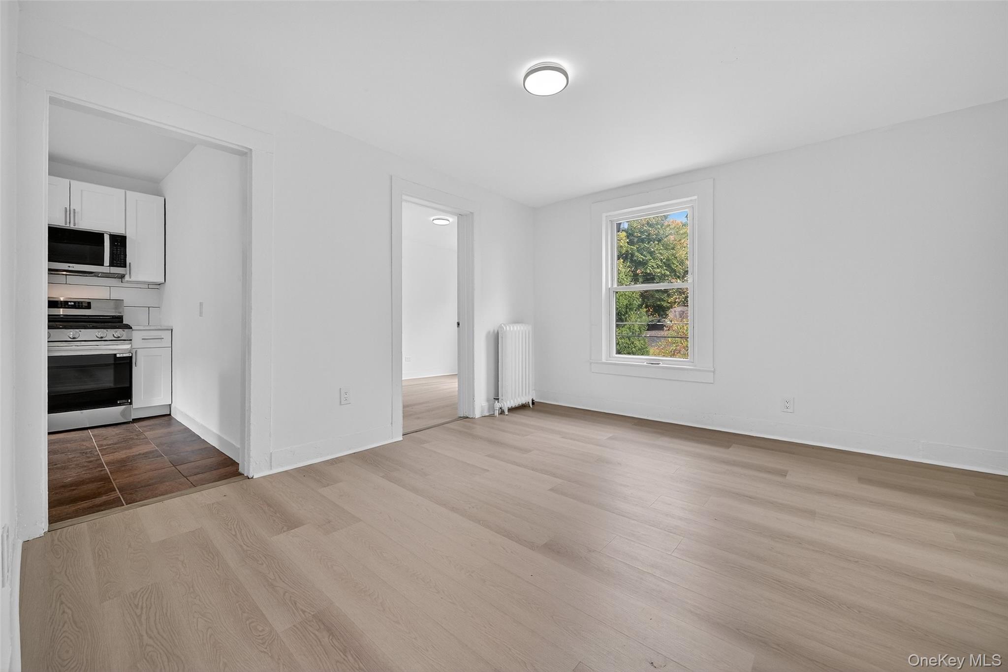 23 Ann Street, Unit 2 Ossining, NY 10562 - Photo 13 of 23 an empty room with windows and closet