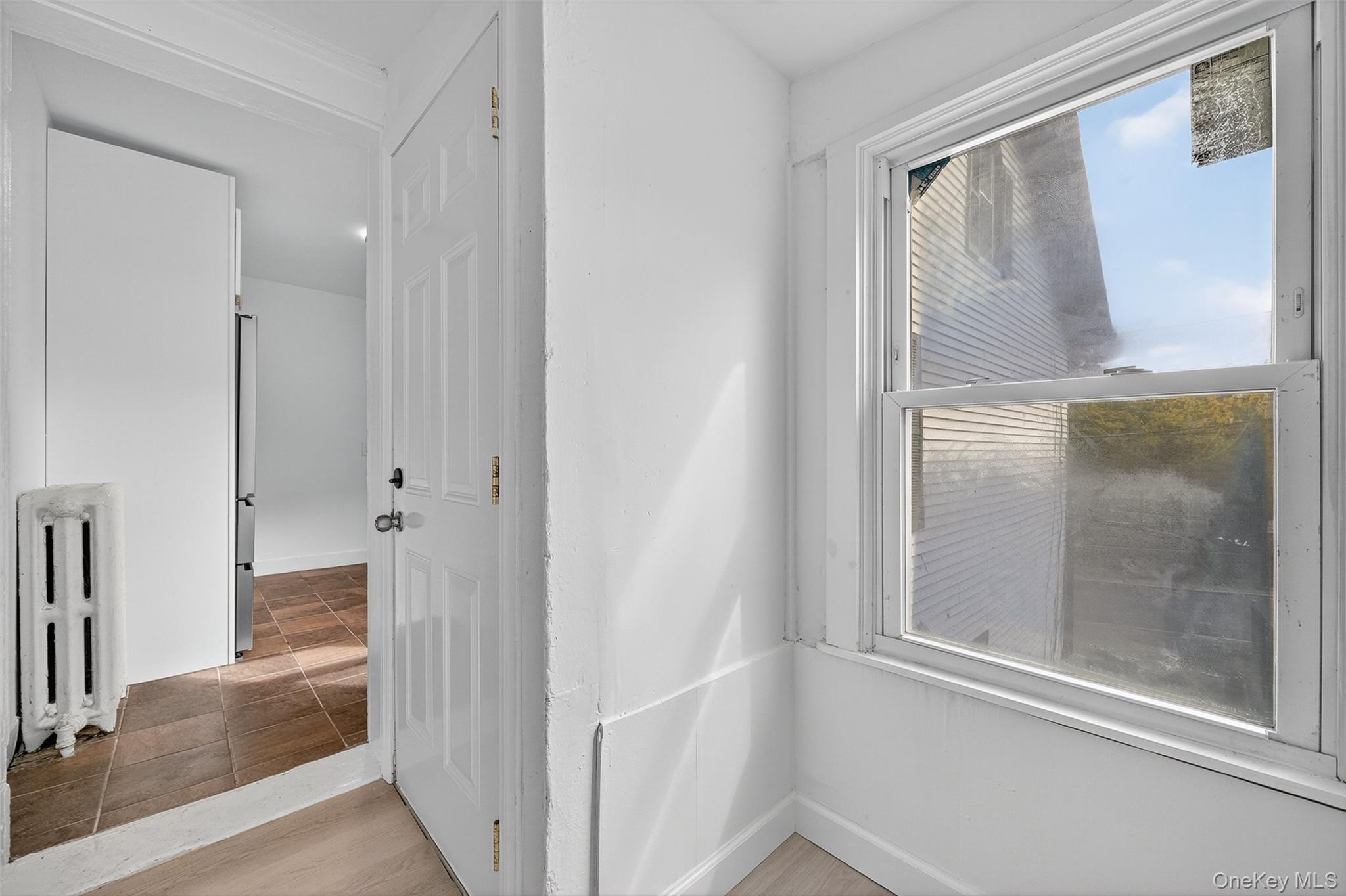 23 Ann Street, Unit 2 Ossining, NY 10562 - Photo 21 of 23 a bathroom with a glass shower door and mirror