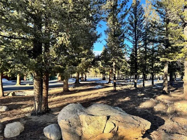 a view of swimming pool with a patio and a yard