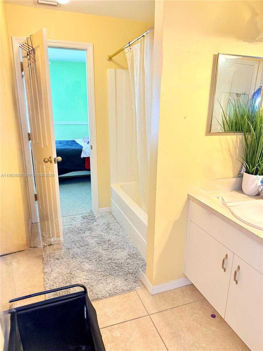 126 Zenith Circle Fort Myers, FL 33913 - Photo 15 of 24 a en suite bathroom with a granite countertop sink and a mirror