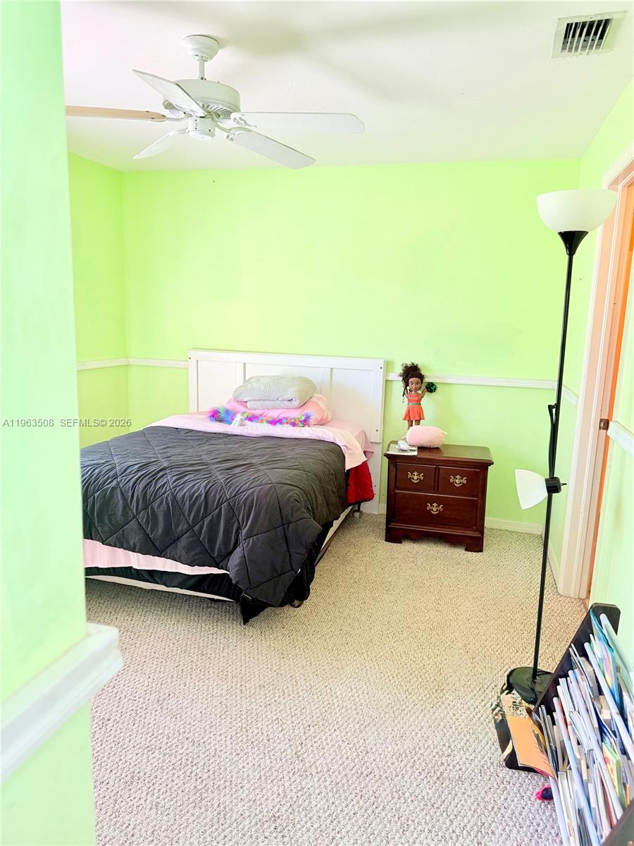 126 Zenith Circle Fort Myers, FL 33913 - Photo 17 of 24 a bedroom with a bed and a flat screen tv