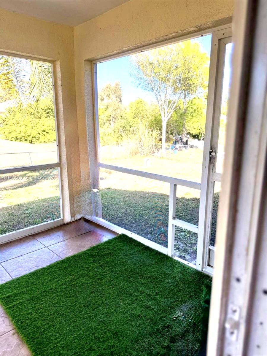 126 Zenith Circle Fort Myers, FL 33913 - Photo 20 of 24 a view of back yard from a window