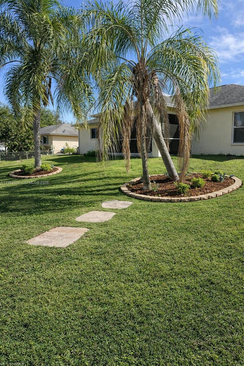 126 Zenith Circle Fort Myers, FL 33913 - Photo 23 of 24 a front view of a house with garden