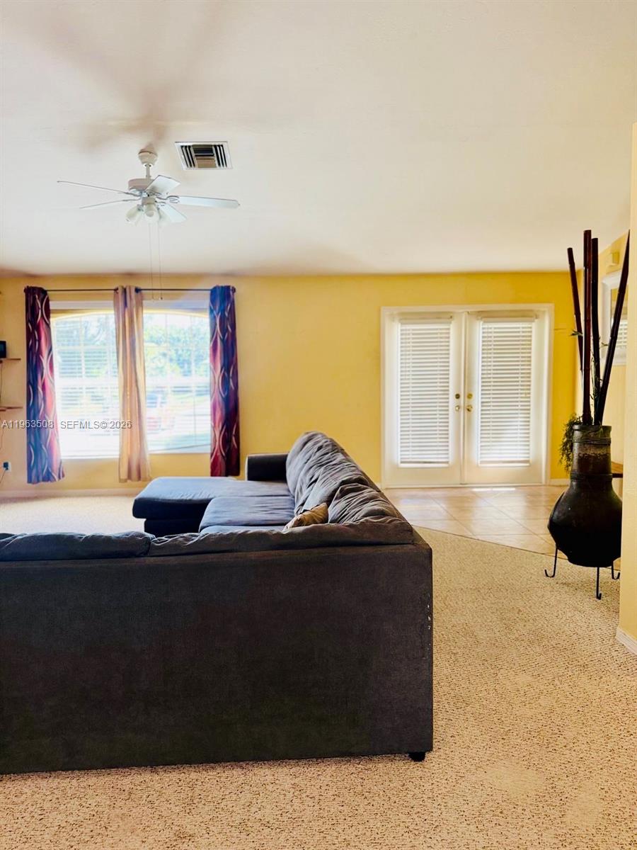 126 Zenith Circle Fort Myers, FL 33913 - Photo 3 of 24 a bedroom with a bed and a large window