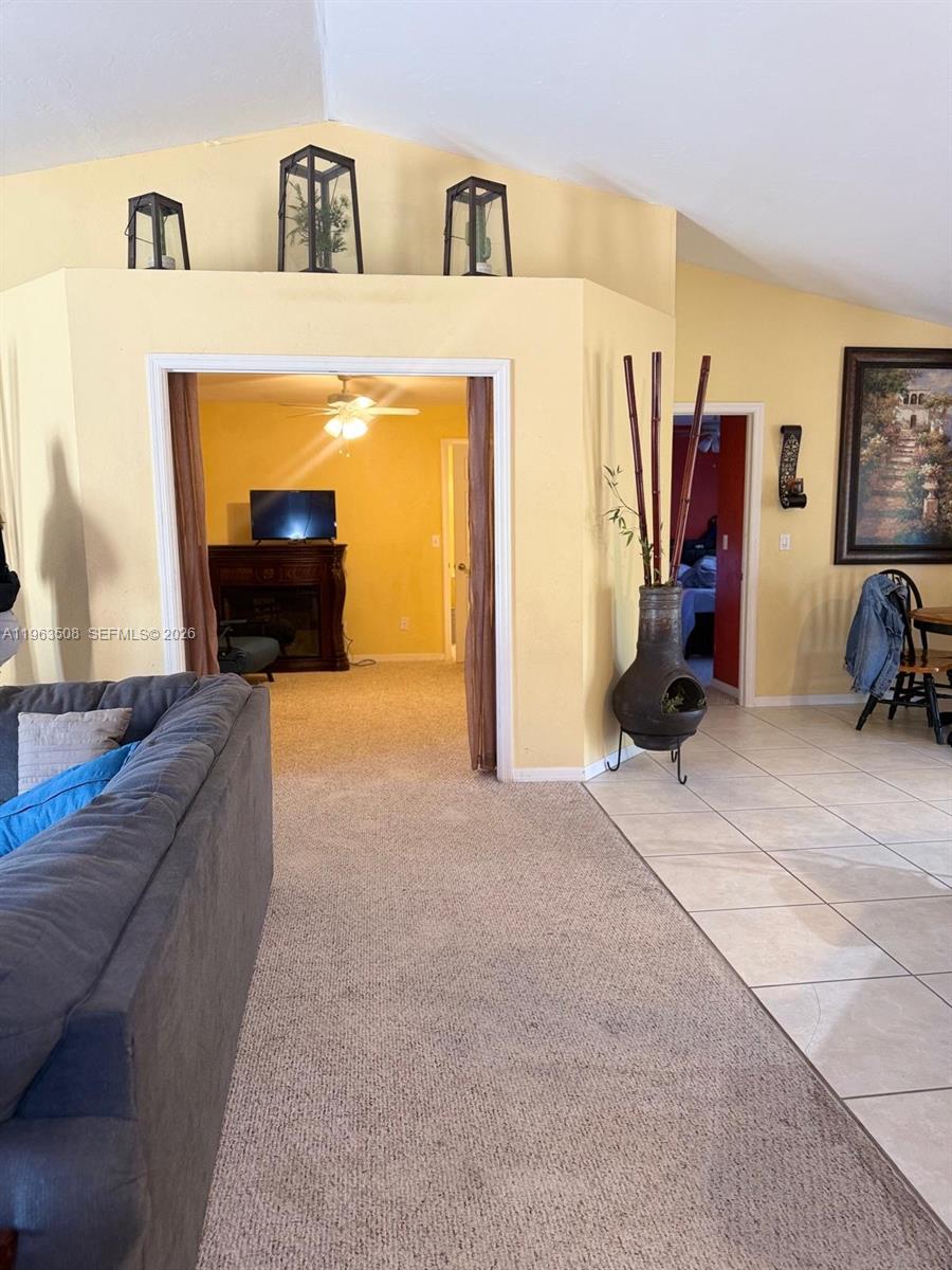 126 Zenith Circle Fort Myers, FL 33913 - Photo 5 of 24 a living room with furniture and a flat screen tv