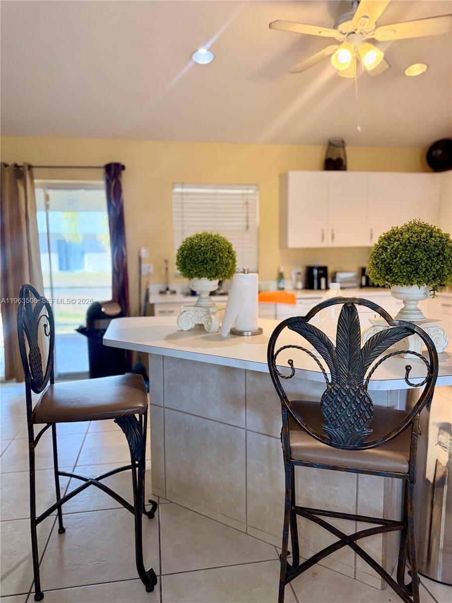 126 Zenith Circle Fort Myers, FL 33913 - Photo 7 of 24 a view of a dining room with furniture and a chandelier