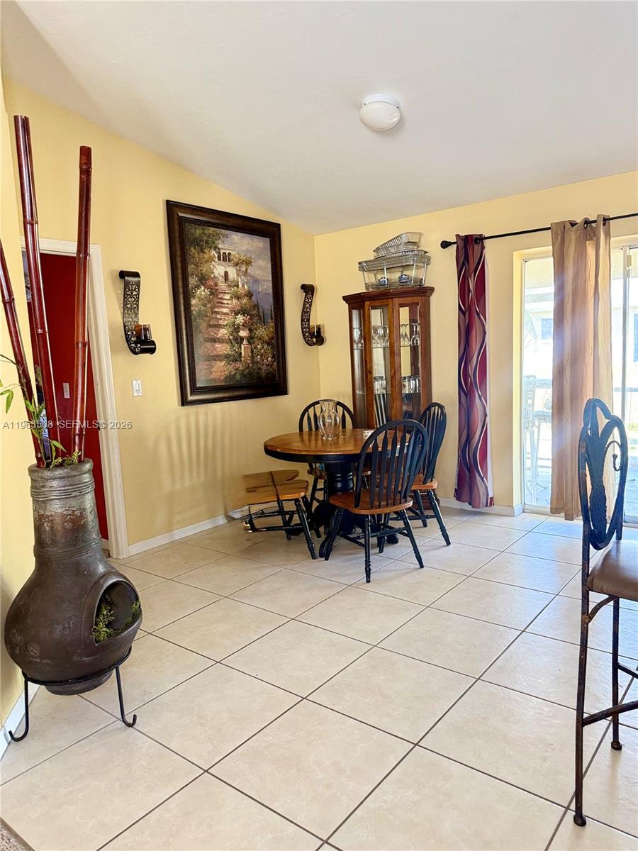 126 Zenith Circle Fort Myers, FL 33913 - Photo 9 of 24 a living room with furniture and a large window