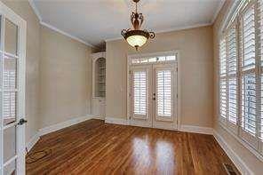 802 Pathview Court Dacula, GA 30019 - Photo 7 of 56 a view of an empty room with wooden floor and a window