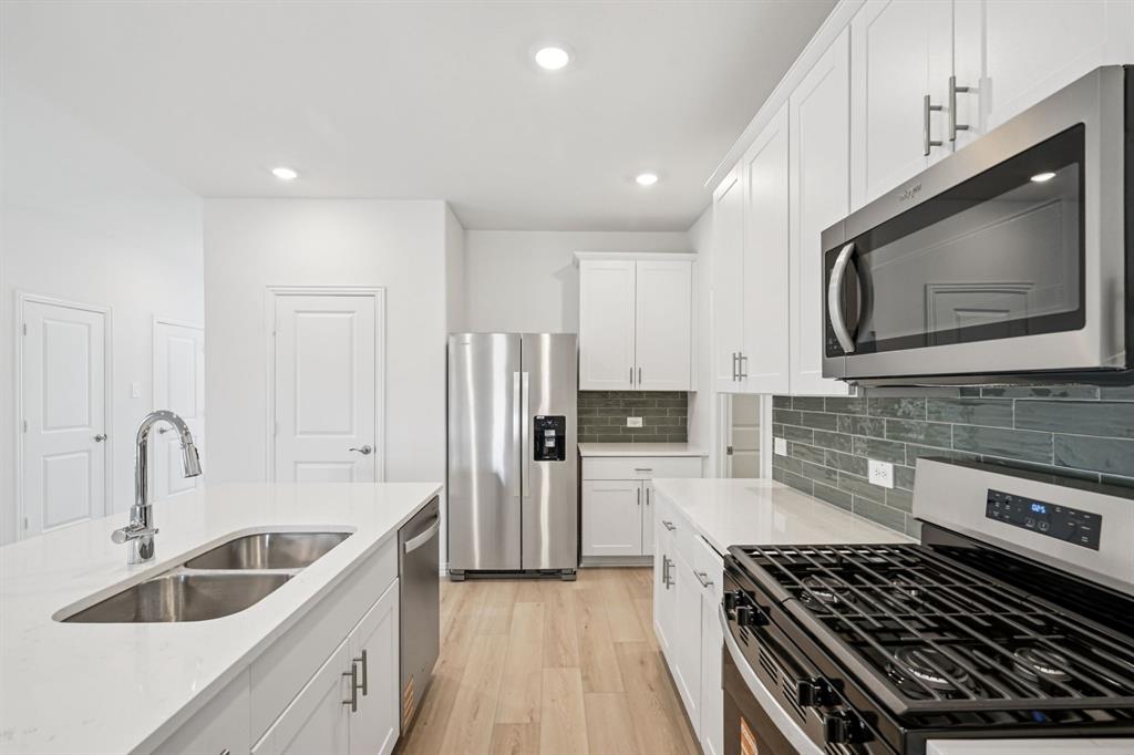 1705 Arches Road Anna, TX 75409 - Photo 7 of 29 Photo is not of the actual home, but is an inspirational photo of builder’s model home and may depict options, furnishings, and/or decorator features that are not included.