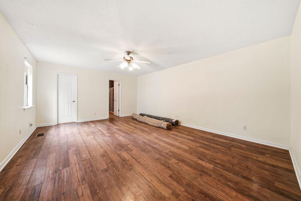 483 Allgood Road Flintstone, GA 30725 - Photo 15 of 34 an empty room with wooden floor and windows