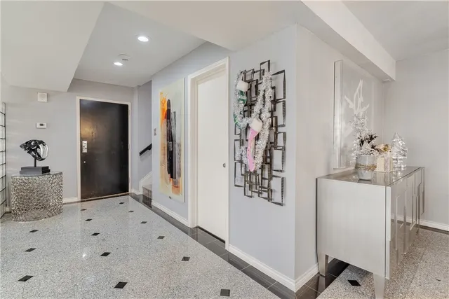 a bedroom with furniture and large window