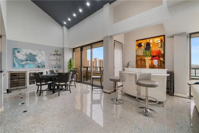 a view of a dining room with furniture window and outside view