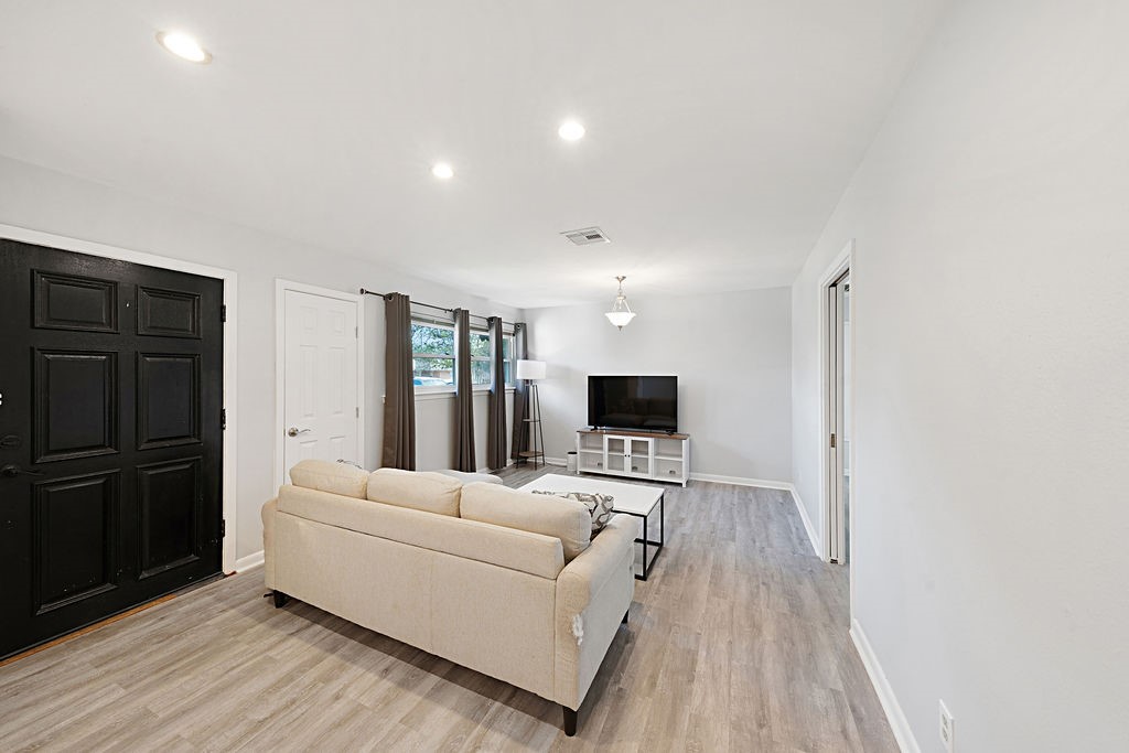 614 Gilpin Street Houston, TX 77034 - Photo 4 of 27 As you enter the home, you are greeted by the open living space that boast natural light from the high windows along the front wall.