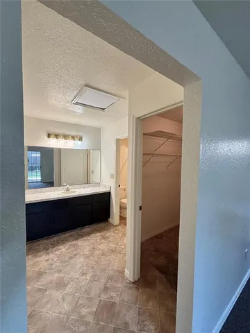 a white toilet sitting next to a bath tub and a shower