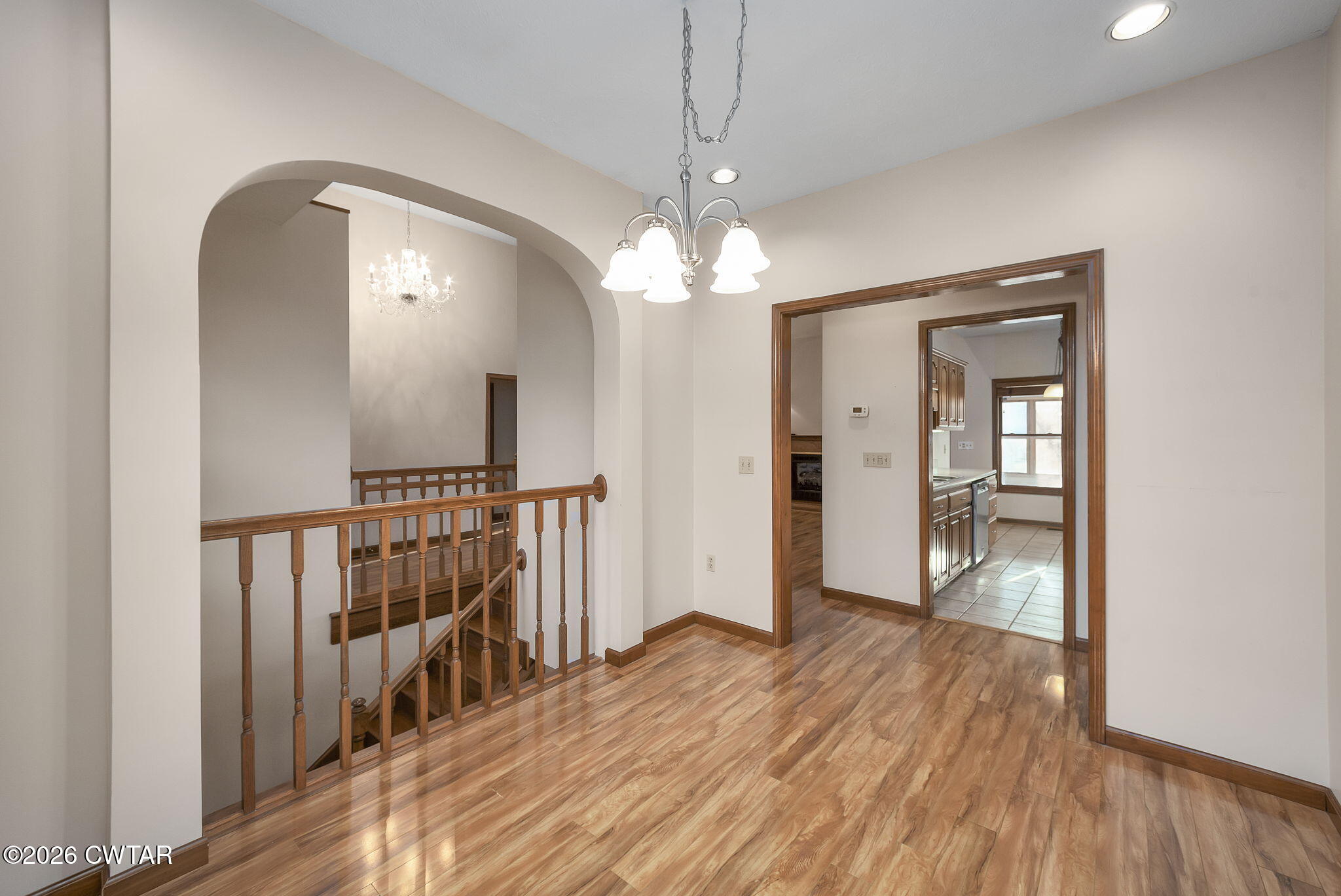 40 Pine Cove Parsons, TN 38363 - Photo 13 of 56 a view of a room with wooden floor staircase and a ceiling fan