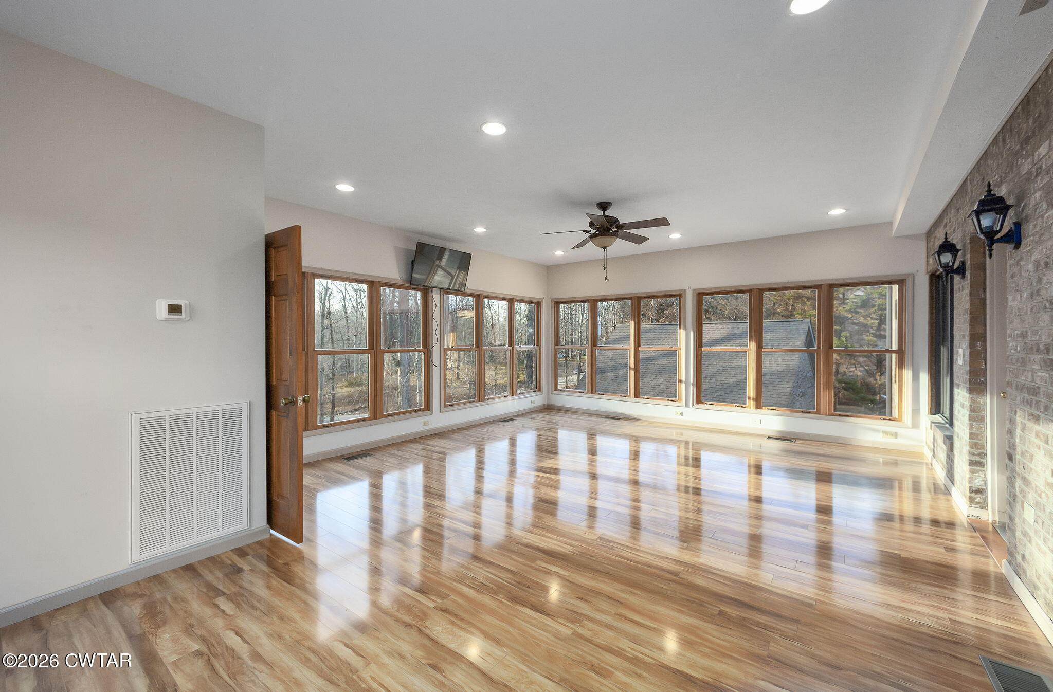 40 Pine Cove Parsons, TN 38363 - Photo 14 of 56 a view of an empty room with wooden floor and a window