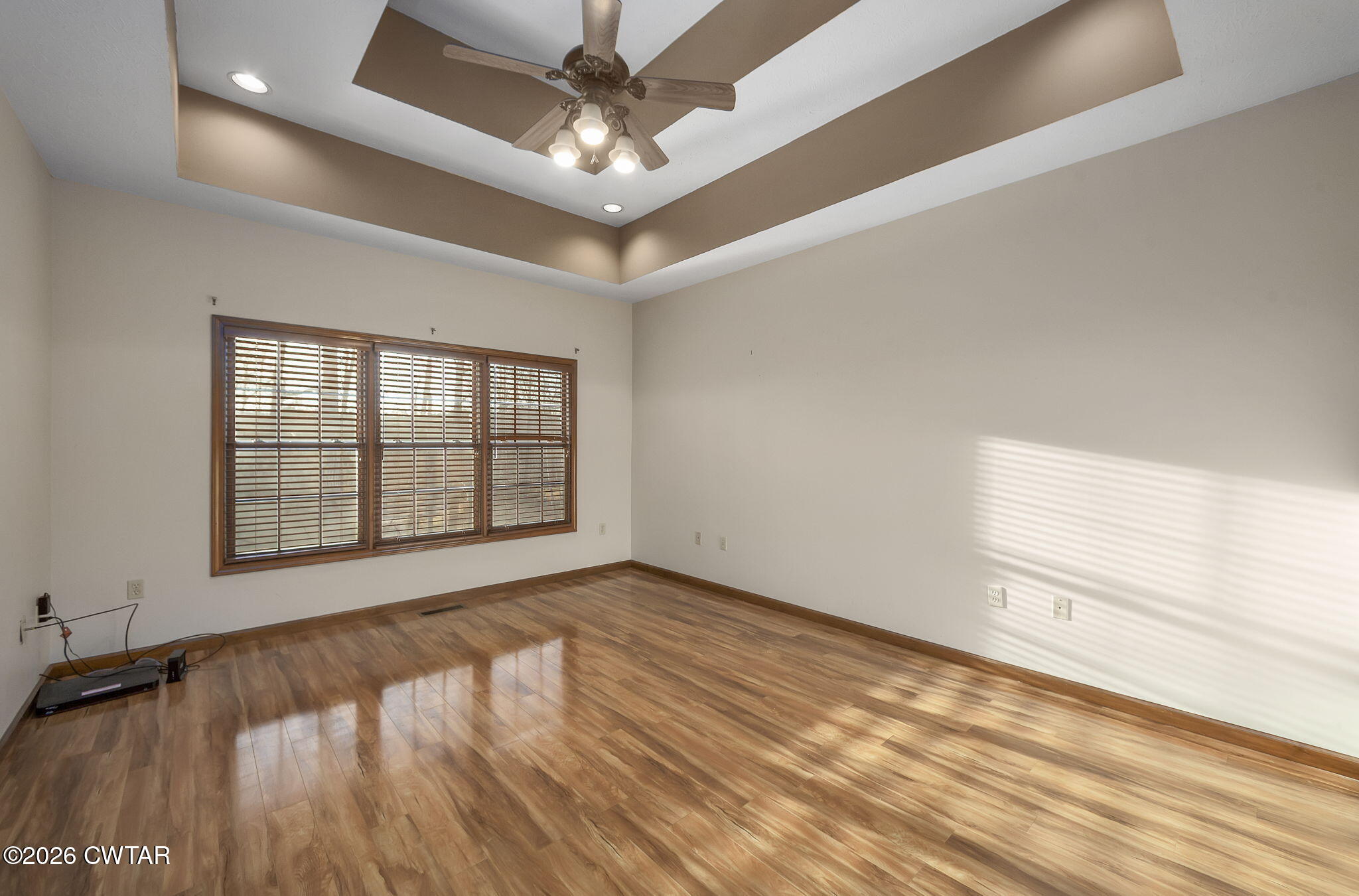 40 Pine Cove Parsons, TN 38363 - Photo 17 of 56 an empty room with wooden floor and windows