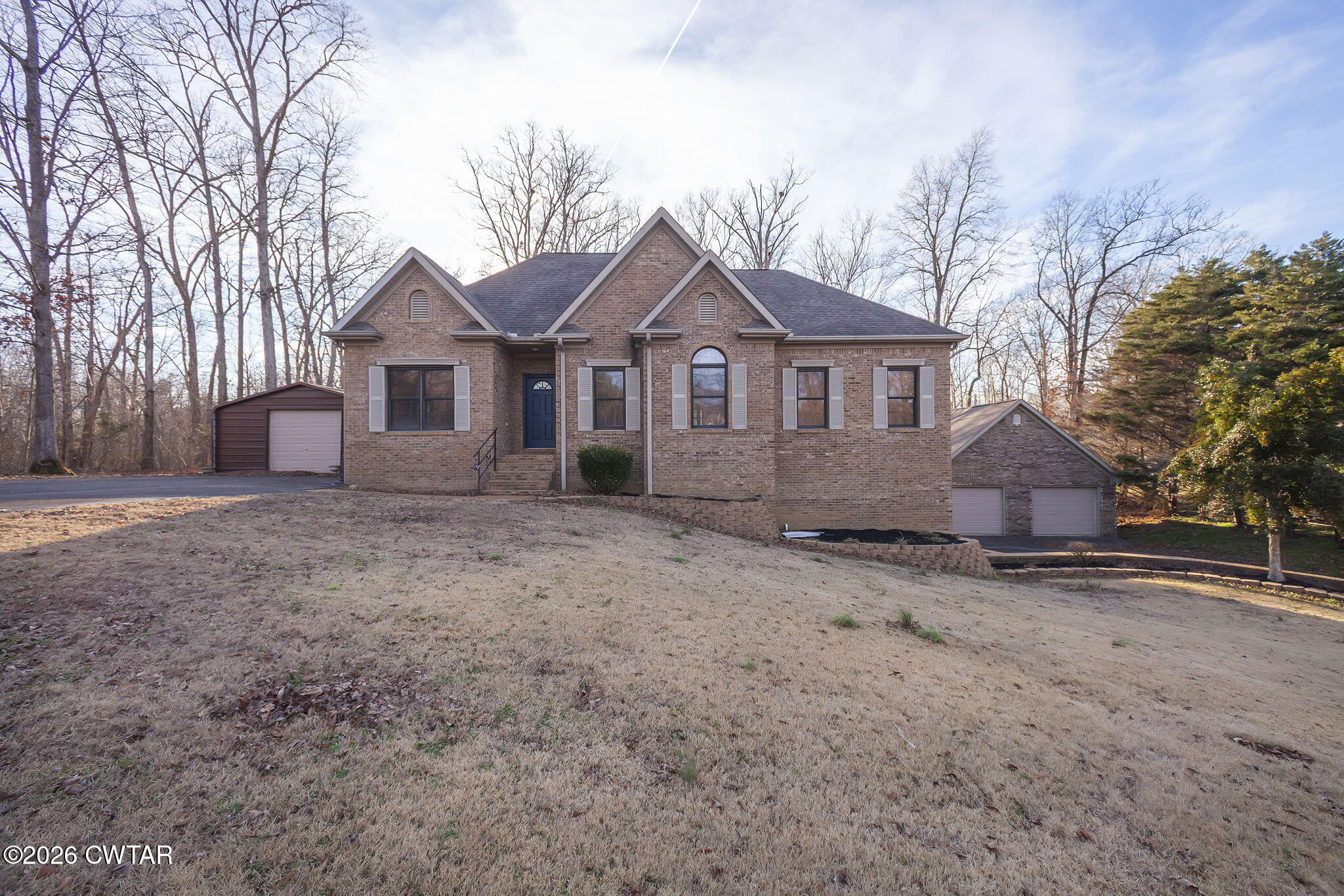 40 Pine Cove Parsons, TN 38363 - Photo 2 of 56 a front view of a house with a yard