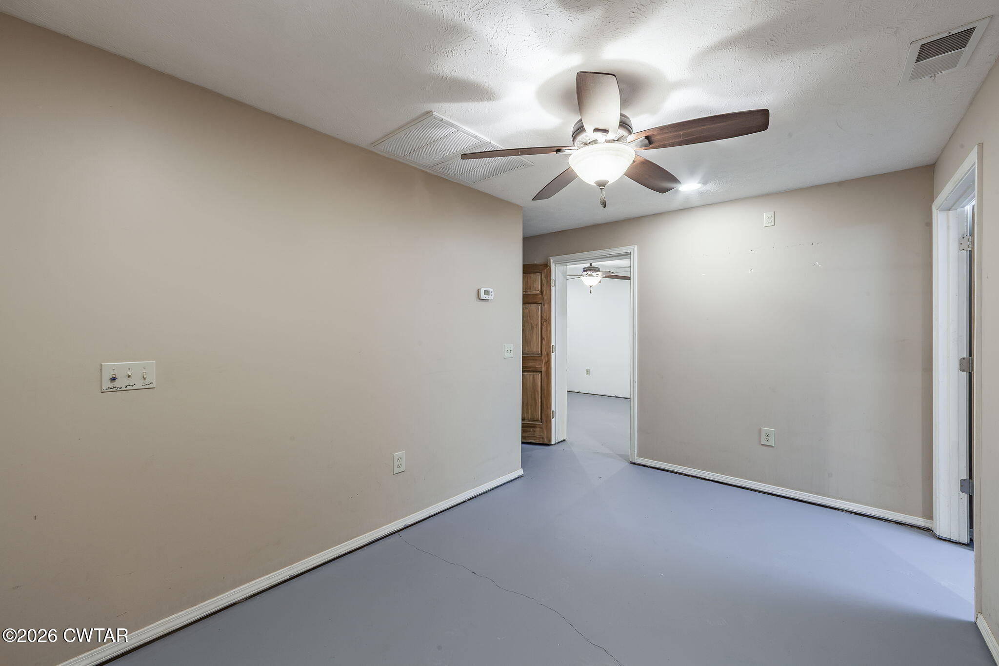 40 Pine Cove Parsons, TN 38363 - Photo 27 of 56 an empty room with a fan and a fan