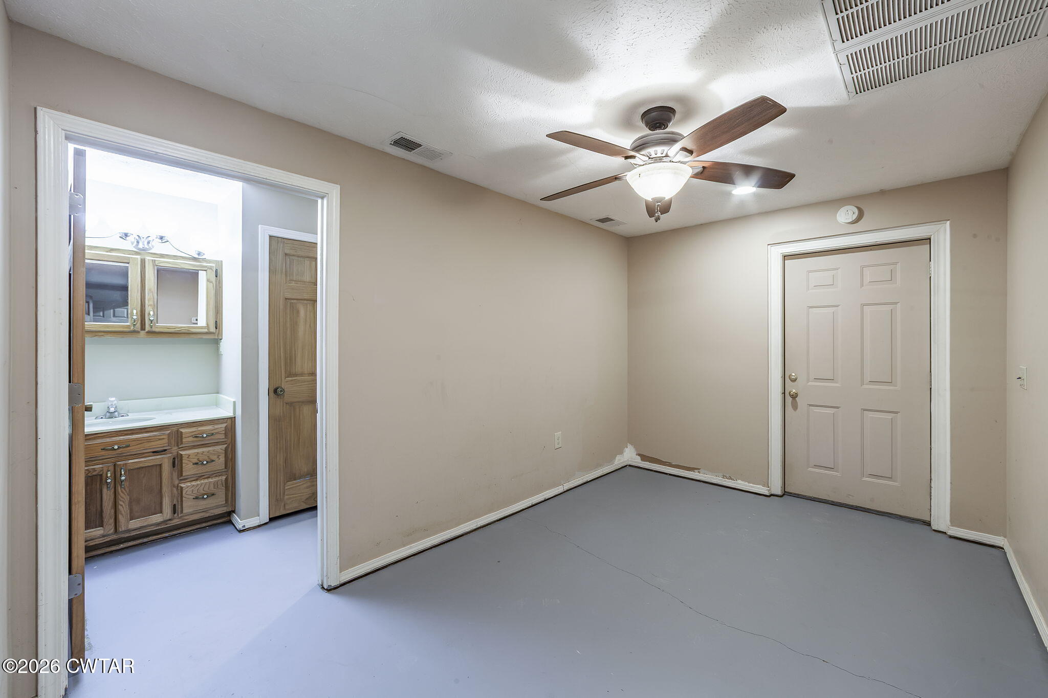 40 Pine Cove Parsons, TN 38363 - Photo 28 of 56 wooden floor in an empty room and a ceiling fan