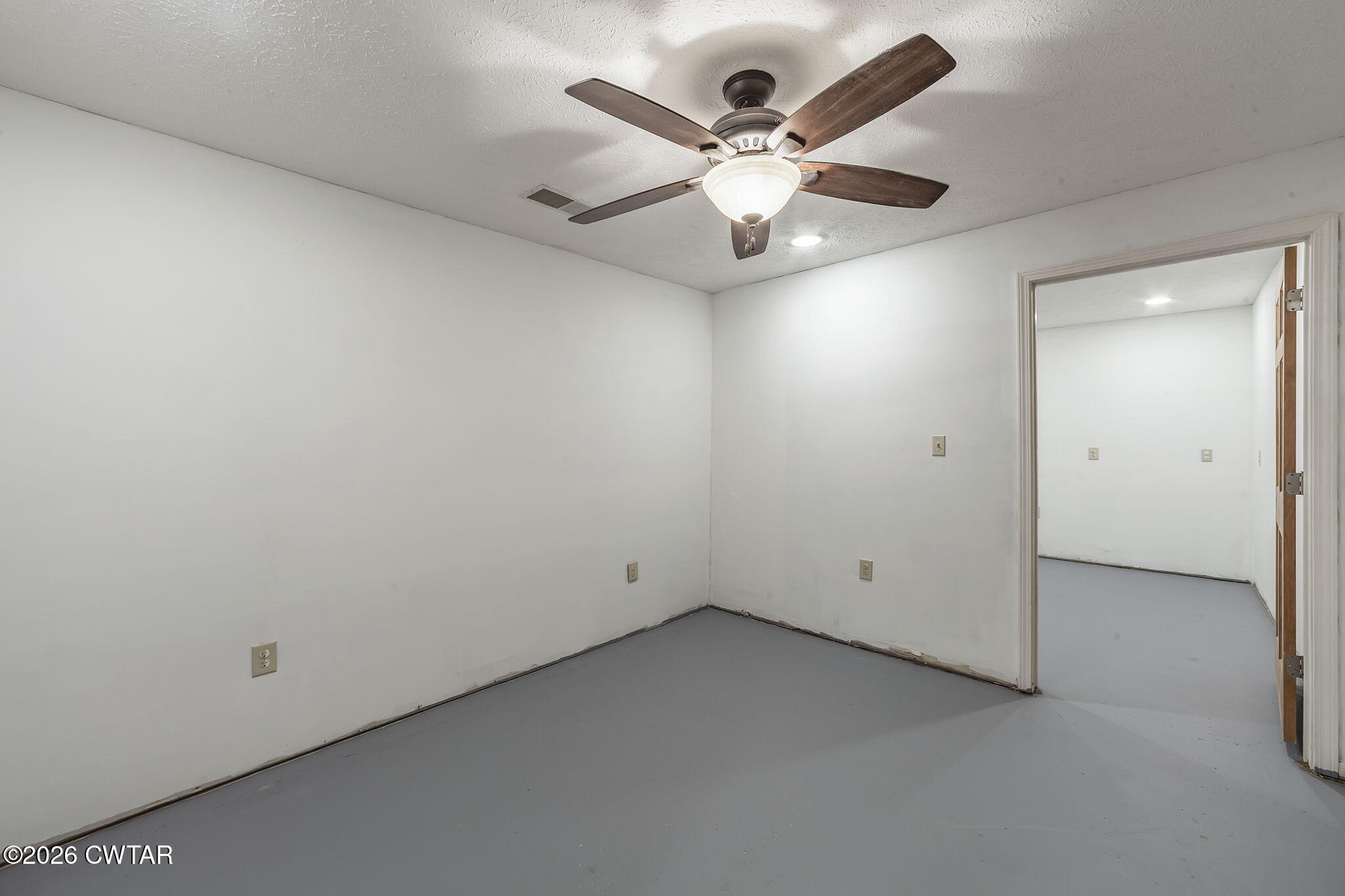 40 Pine Cove Parsons, TN 38363 - Photo 29 of 56 an empty room with a window and a fan