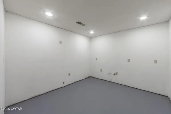 an empty room with entrance and door