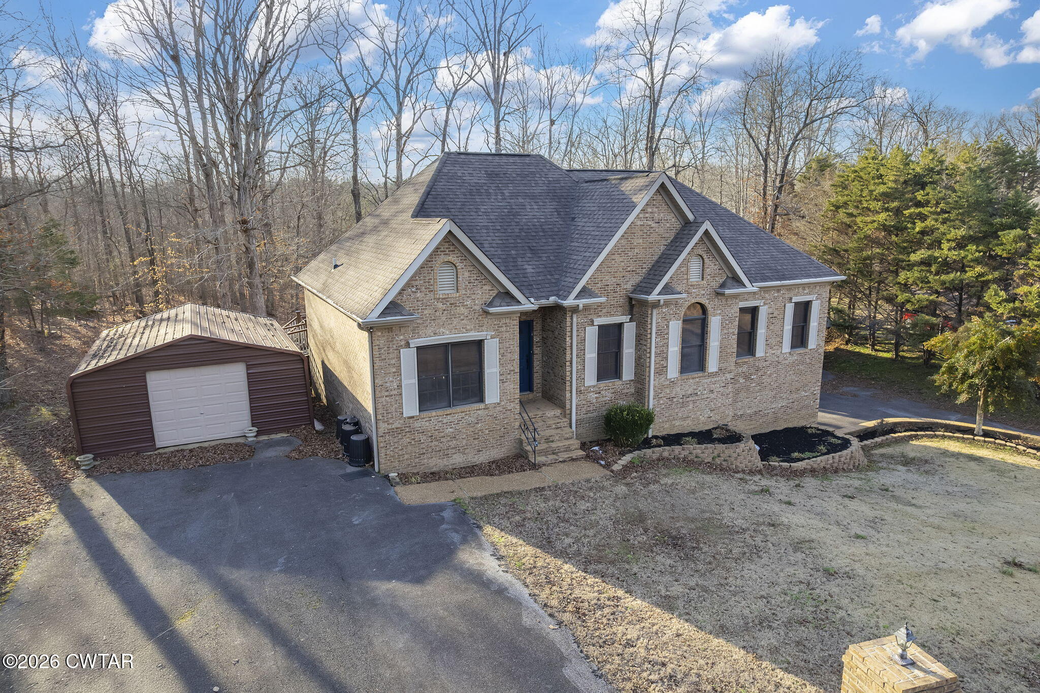 40 Pine Cove Parsons, TN 38363 - Photo 42 of 56 a view of a house with a yard