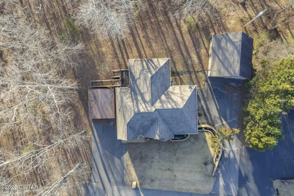 a view of street with wooden fence
