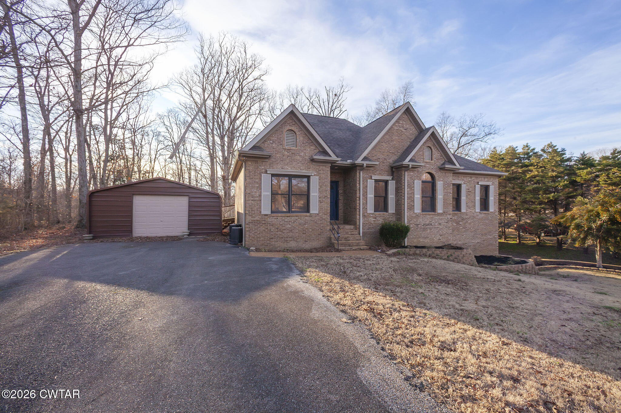40 Pine Cove Parsons, TN 38363 - Photo 49 of 56 a view of a house with a yard and large tree