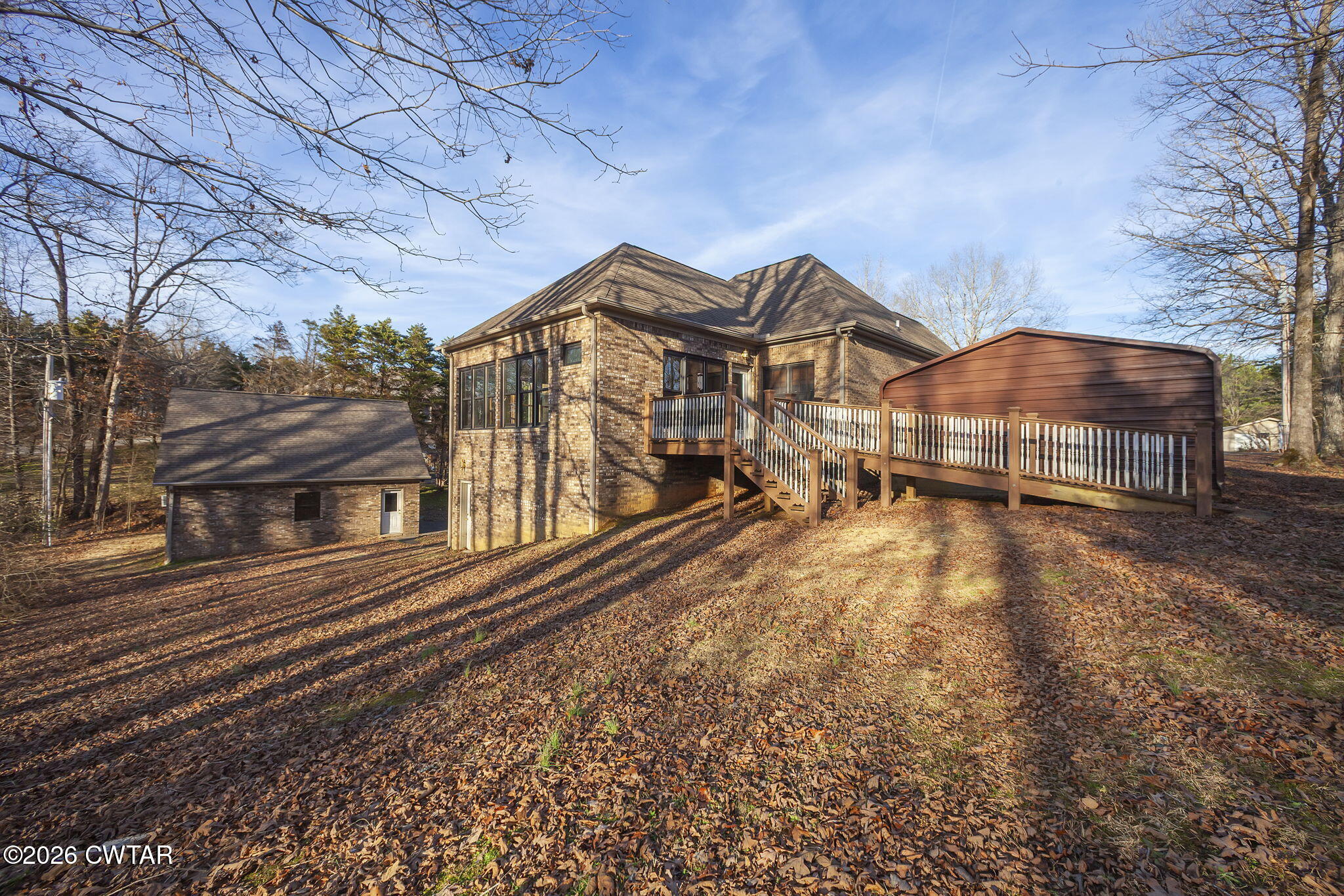 40 Pine Cove Parsons, TN 38363 - Photo 52 of 56 a view of a large house with a yard