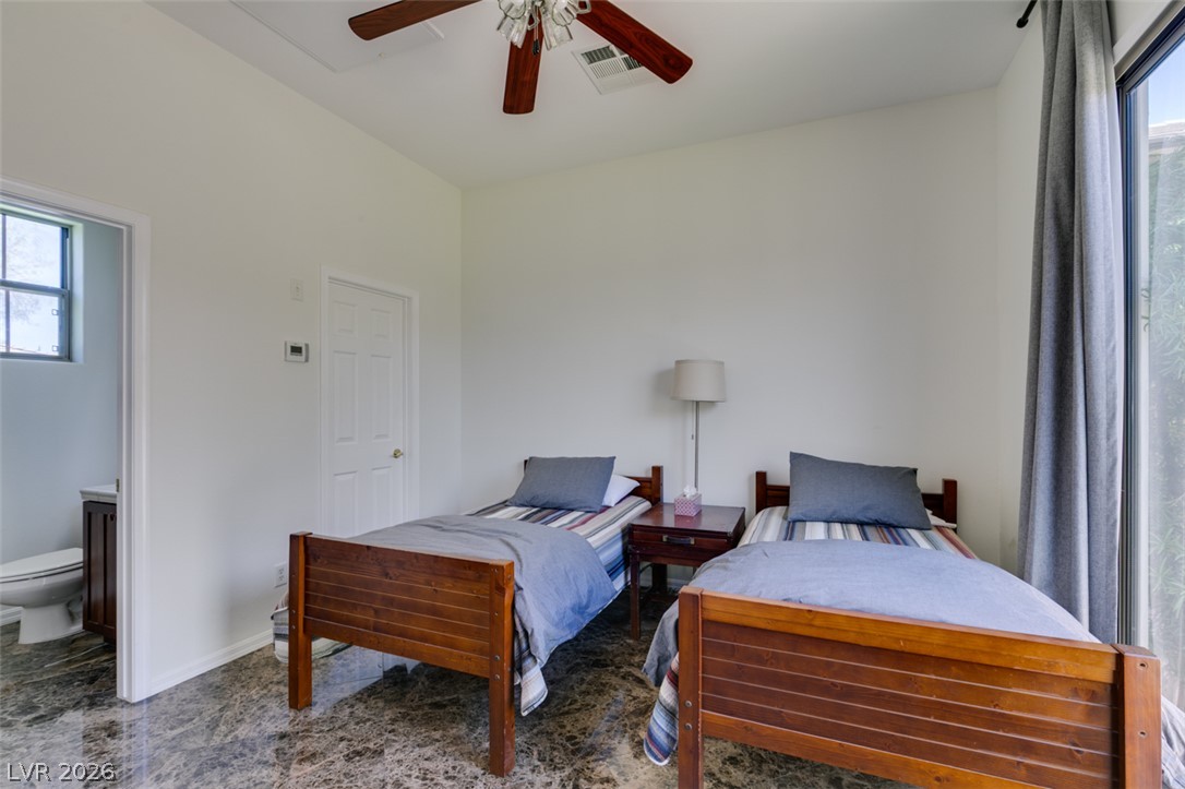 8 Kennesaw Road Henderson, NV 89052 - Photo 35 of 44 Functional sleeping area features durable marble flooring and direct access to an adjacent bath.