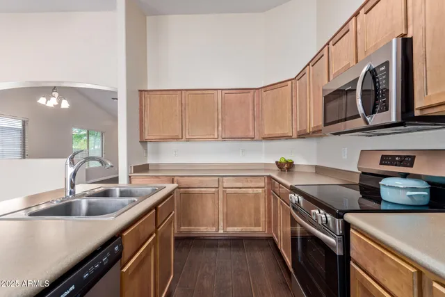 a kitchen with a stove and cabinets