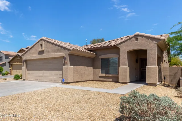 a street view with couple of cars parked in front of it