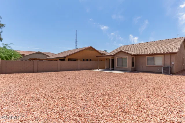 a backyard of a house with a lake view