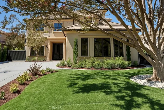 a front view of a house with a yard