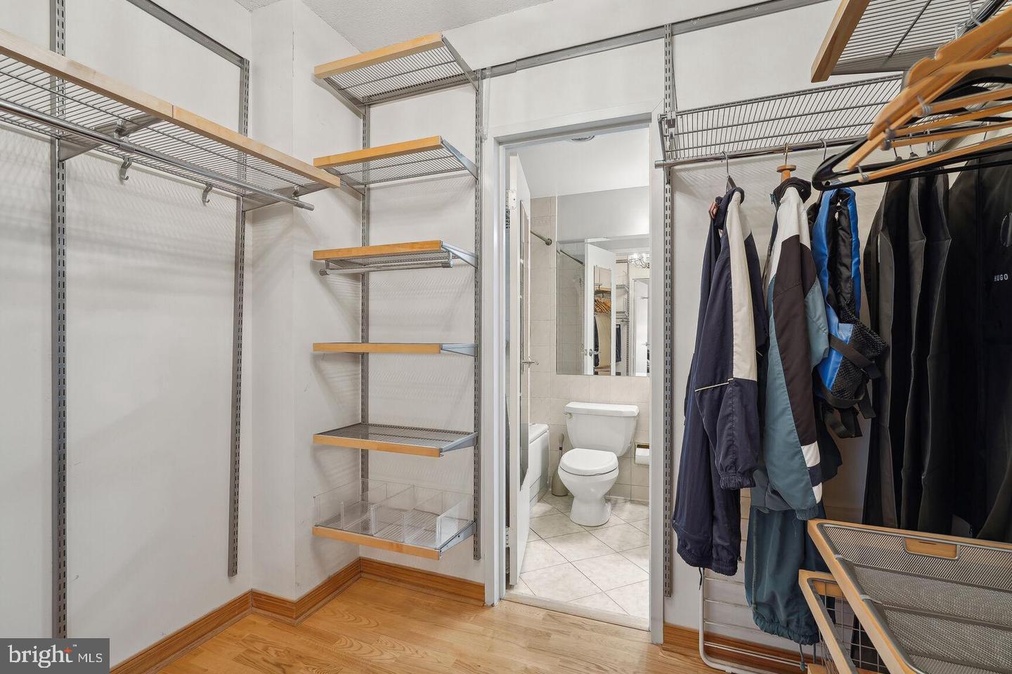 4141 North Henderson Road, Unit 611 Arlington, VA 22203 - Photo 11 of 30 a view of walk in closet with clothes and shoes