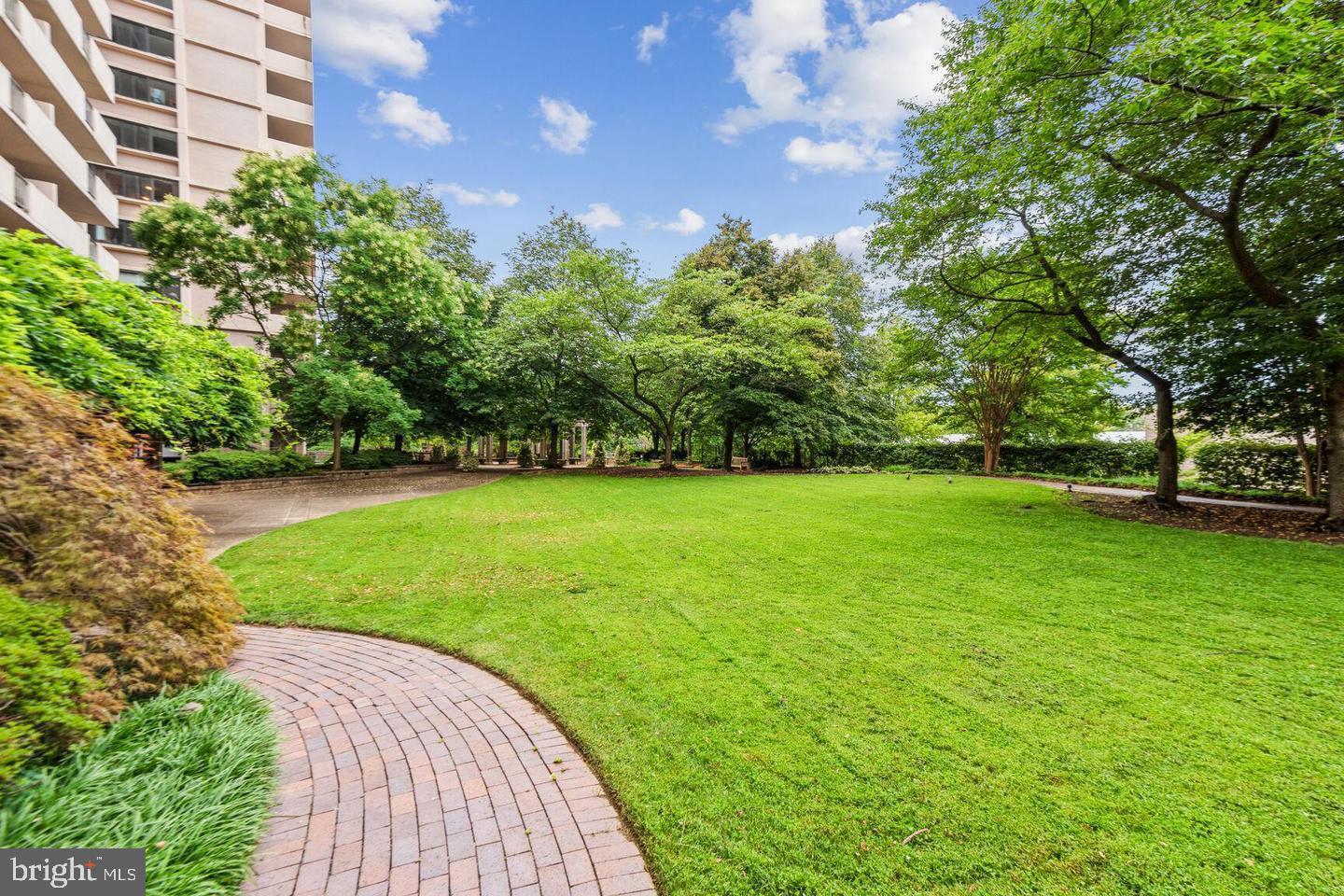 4141 North Henderson Road, Unit 611 Arlington, VA 22203 - Photo 22 of 30 a view of a garden with a building in the background