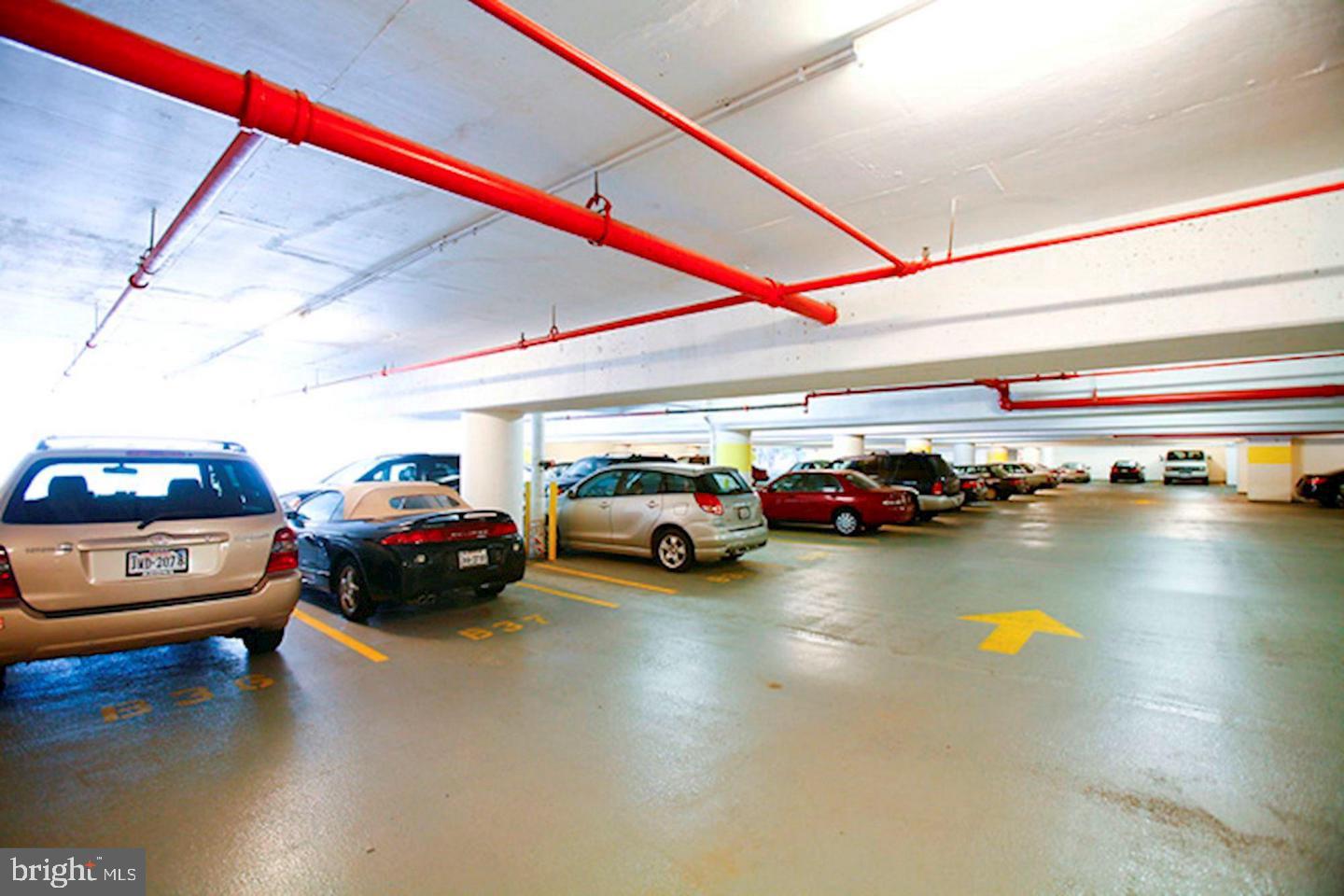 4141 North Henderson Road, Unit 611 Arlington, VA 22203 - Photo 23 of 30 a cars parked in a parking lot next to a road