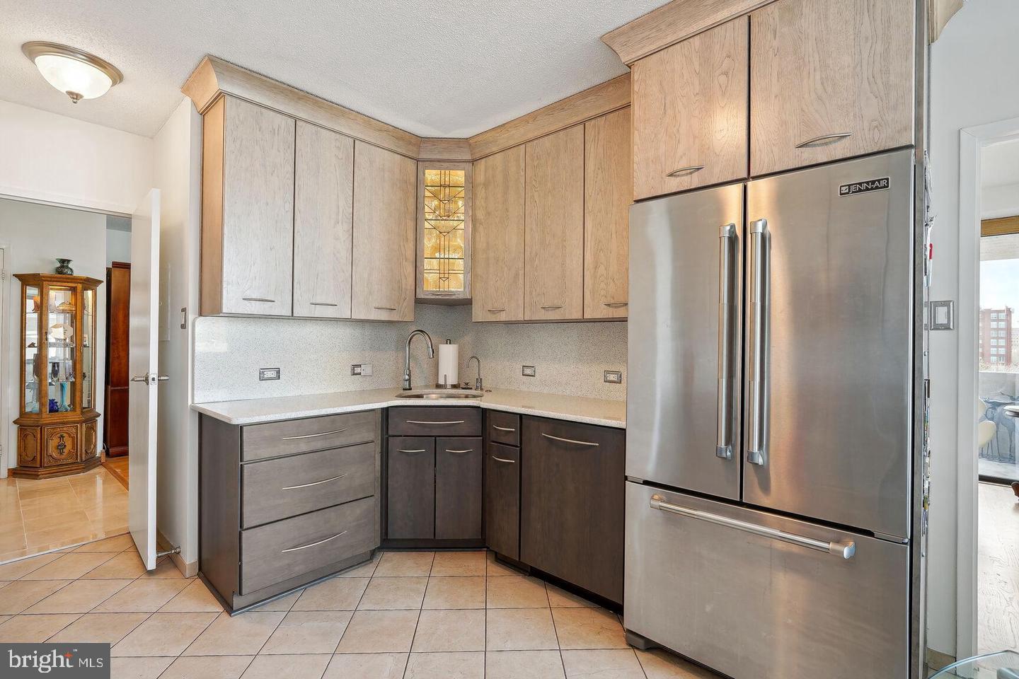 4141 North Henderson Road, Unit 611 Arlington, VA 22203 - Photo 7 of 30 a kitchen with stainless steel appliances granite countertop a refrigerator and a sink