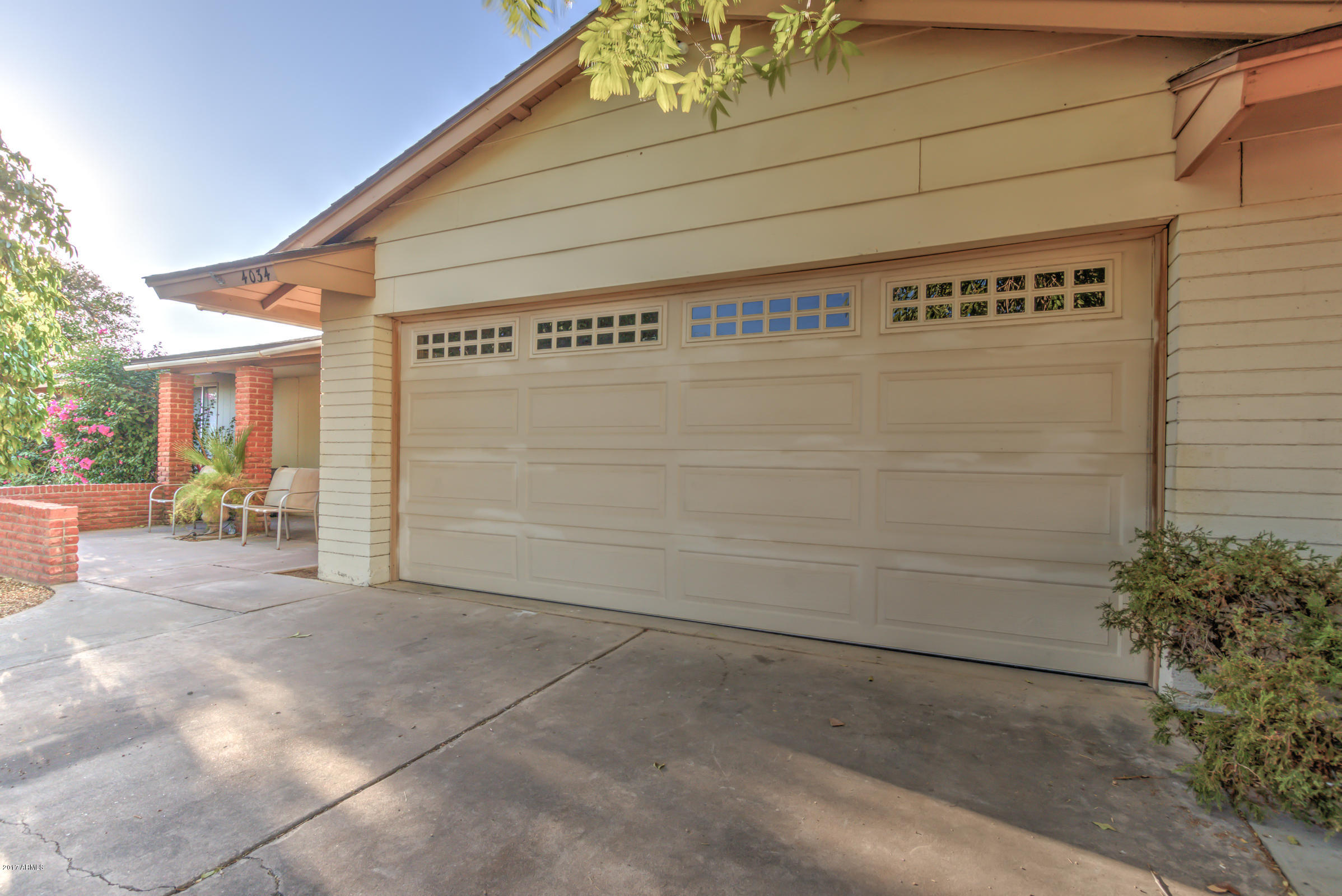 4034 West Hatcher Road Phoenix, AZ 85051 - Photo 3 of 42 03-Garage Door
