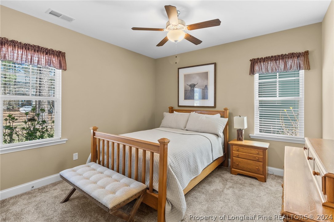 129 Warren Lake Road Aberdeen, NC 28315 - Photo 22 of 50 a bedroom with a bed and a window