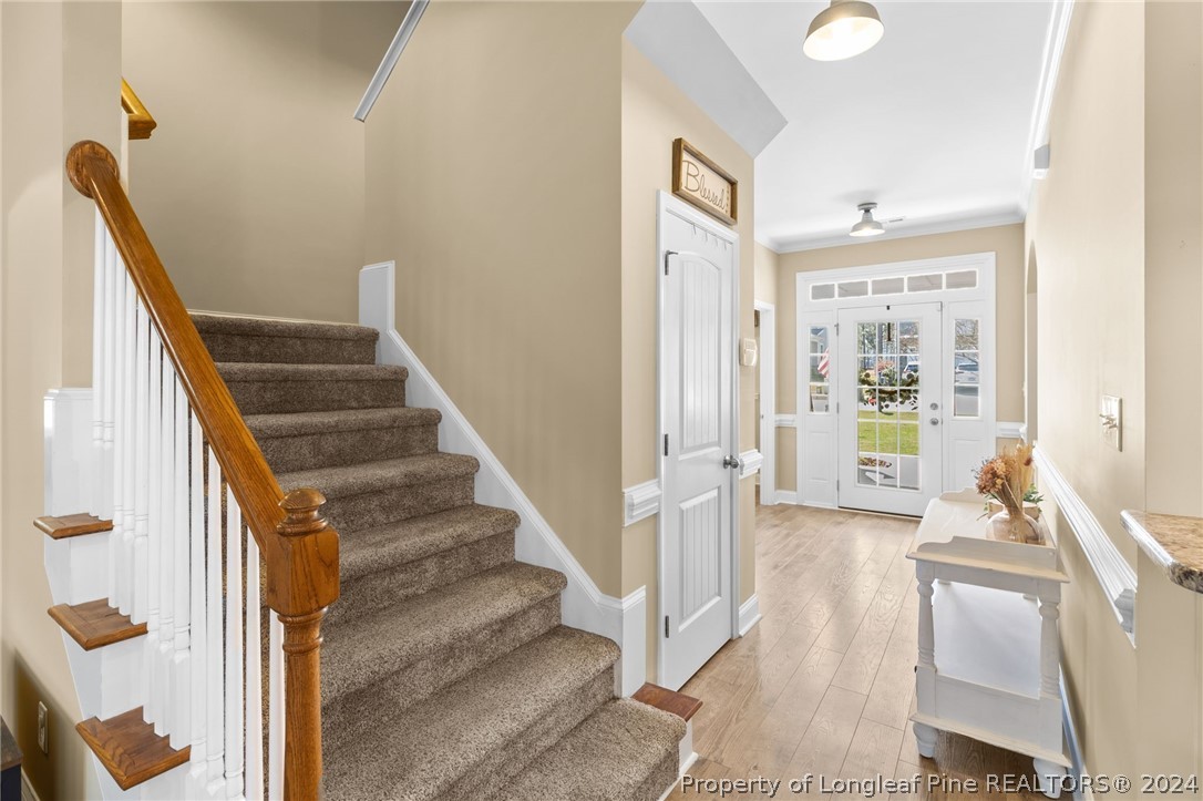 129 Warren Lake Road Aberdeen, NC 28315 - Photo 24 of 50 a view of an entryway with wooden floor and a livingroom view