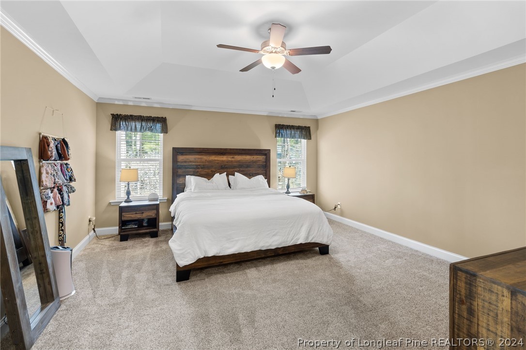 129 Warren Lake Road Aberdeen, NC 28315 - Photo 26 of 50 a bedroom with a bed closet and a window