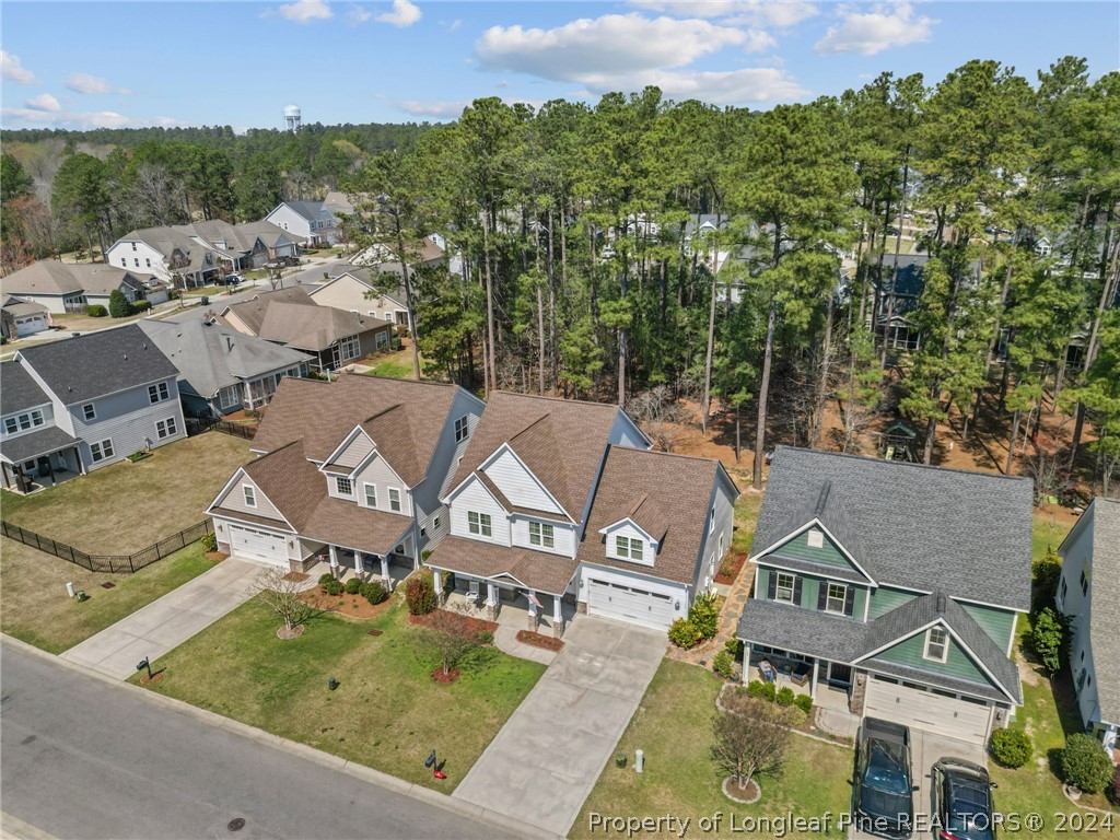 129 Warren Lake Road Aberdeen, NC 28315 - Photo 42 of 50 an aerial view of residential houses with outdoor space and trees