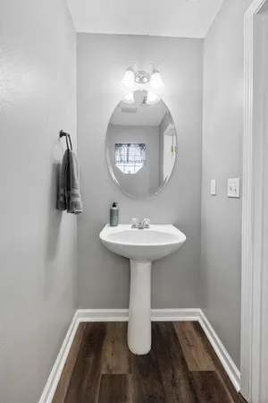 a bathroom with a sink and mirror