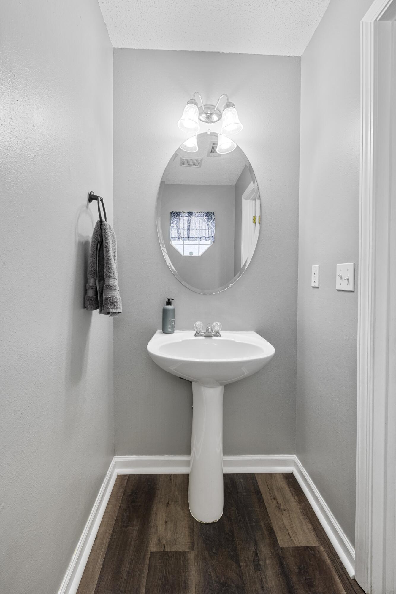 313 Crooked Pine Trail Crestview, FL 32539 - Photo 14 of 43 a bathroom with a sink and mirror