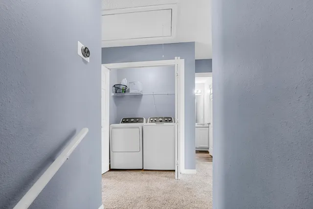 a hallway with cabinets