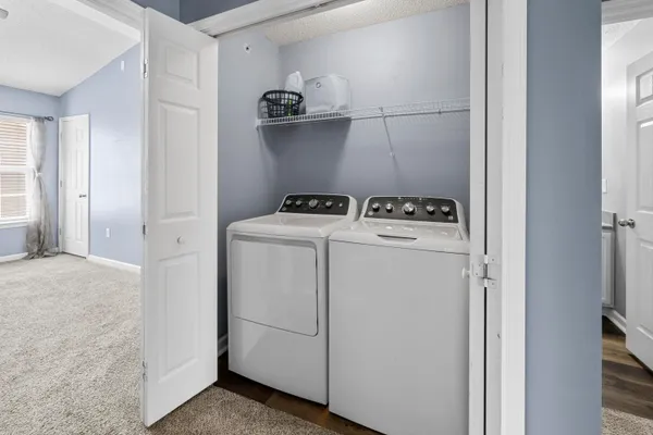 a utility room with dryer and washer